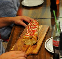 Paesano's Pizzeria with Double Dogs - Mentone - Pubs and Clubs